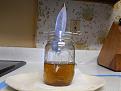 Jar removed and bag suspended over mouth to drip dry.