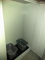 Inside the grow cabinet with the 10 gallon containers to show space.